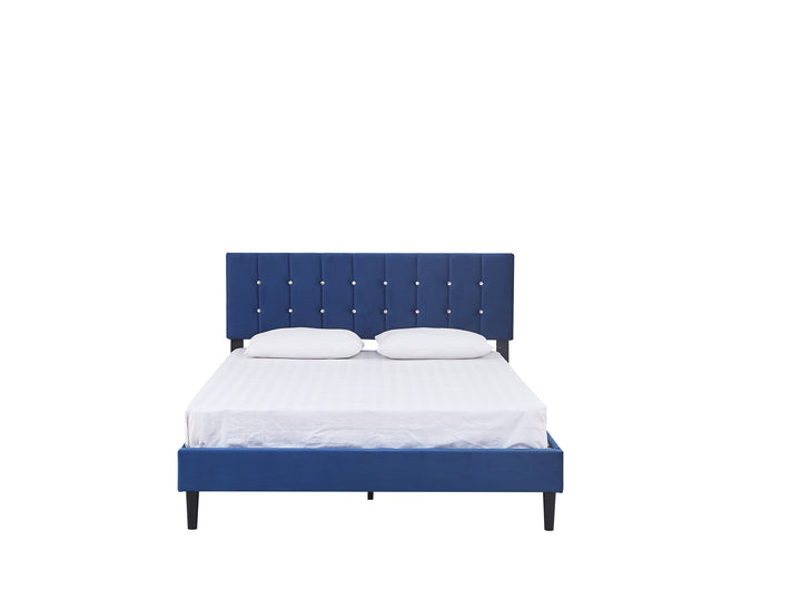 front view of a white mattress and pillows on a royal blue velvet upholstered bed base with a headboard decorated with faux diamond buttons