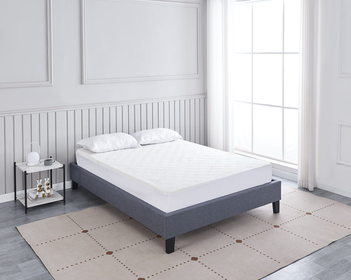 bedroom with angle view of grey upholstered Daytona bed base with wooden slats