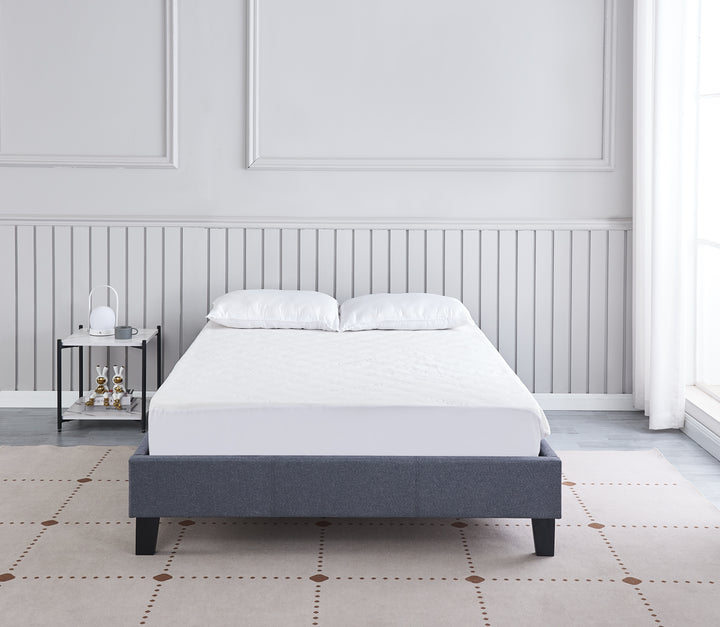 bedroom with front view of grey upholstered Daytona bed base with wooden slats