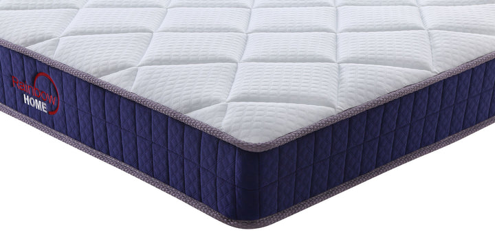 corner view of white and purple bonnell coil mattress from Rainbow Home