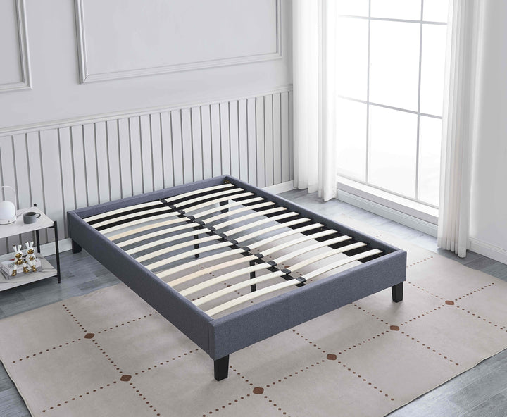 bedroom with angle view of grey upholstered Daytona bed base with wooden slats